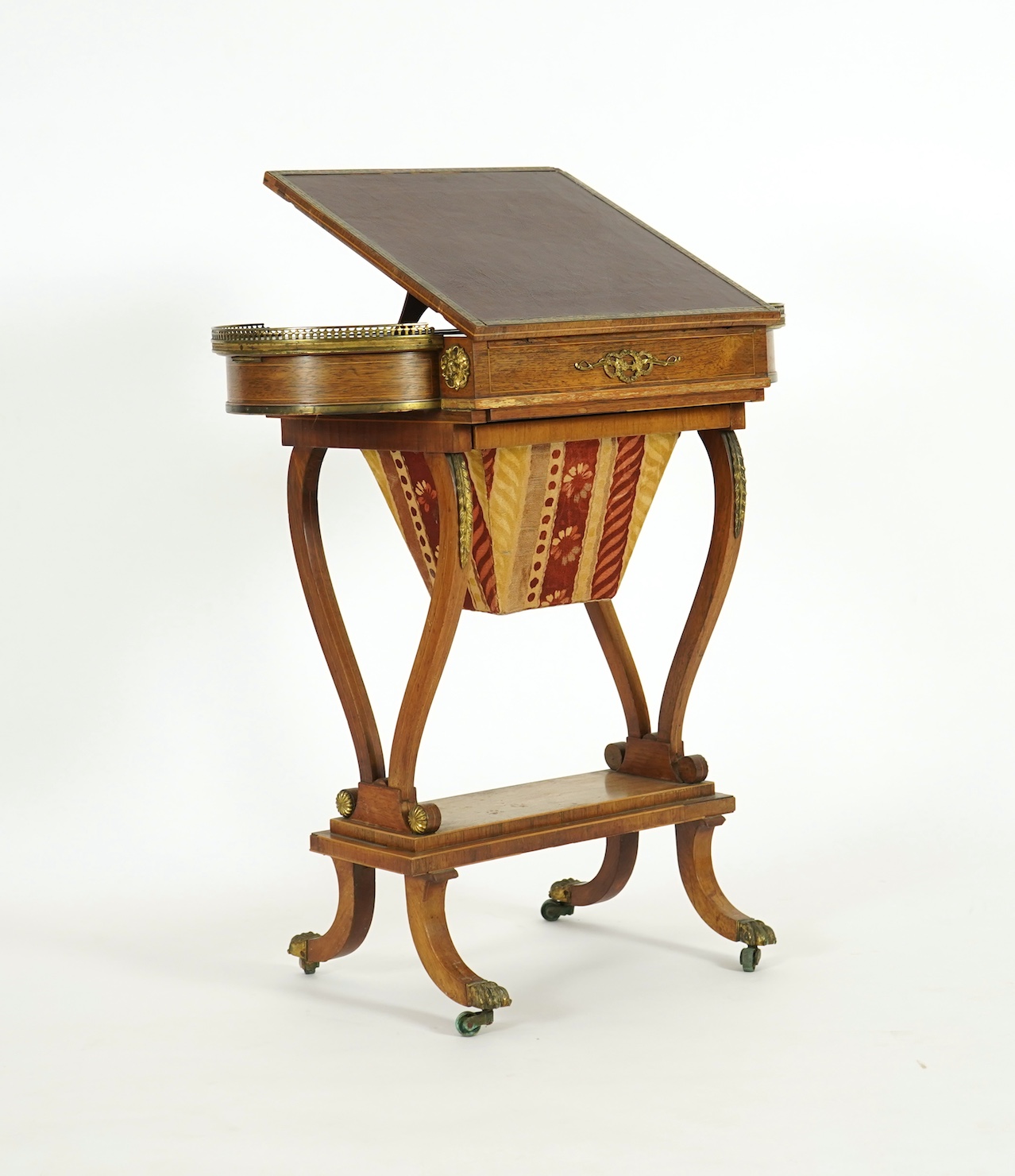 A Regency brass mounted rosewood writing, games and work table